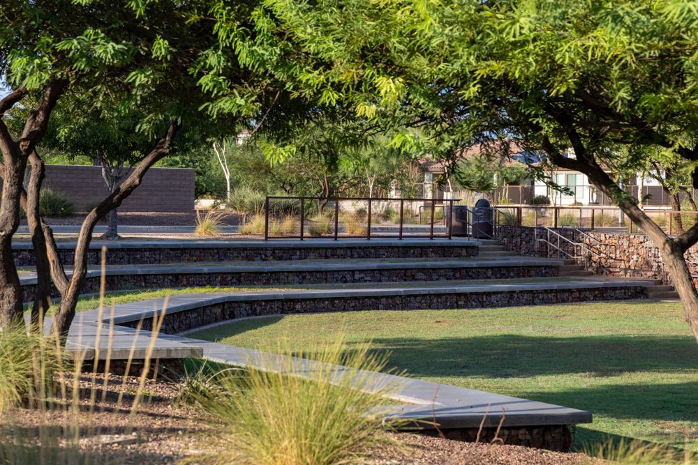 Shaded park path and seating in The Meadows